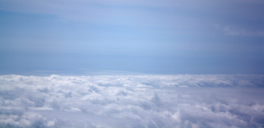 A photograph of clouds from above, taken from an aeroplane window