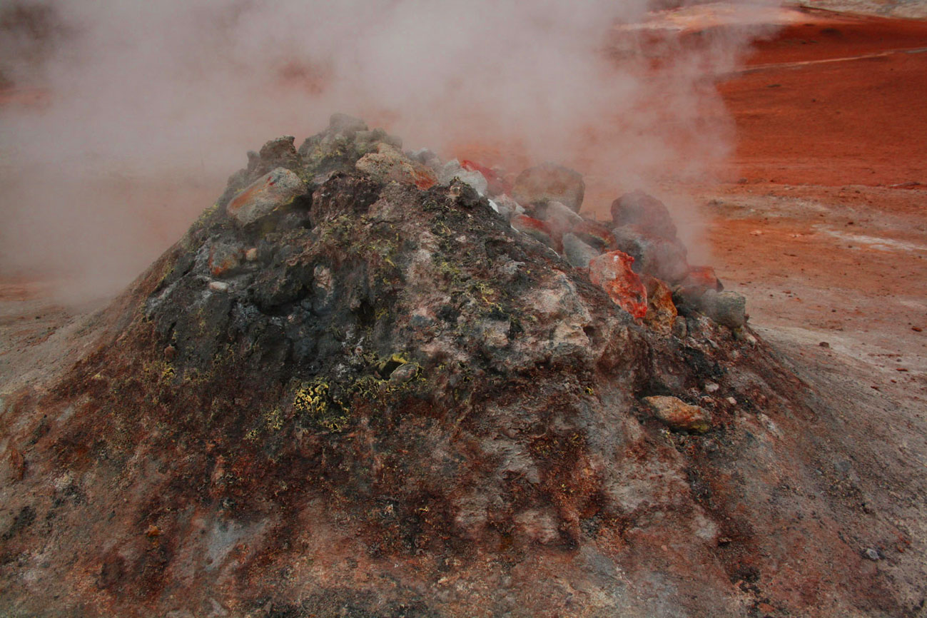 A photograph of a geothermal steam-stack edited to look more volcanic